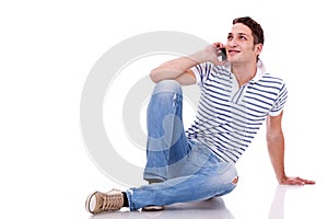 Young casual man talking on the phone
