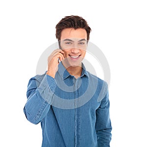 Young casual man talking on the phone and smiles