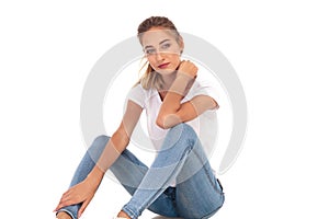 Young casual seated woman relaxing