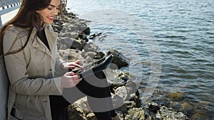 Young casual woman holding a tablet