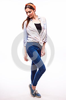 Young casual woman style over white background. studio portrait female model.