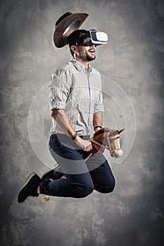 Young caucasian adult man enjoy experiencing immersive Virtual Reality cowboy game simulation.VR portrait concept with