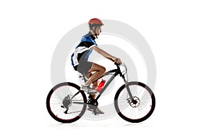 Young Caucasian boy bike rider with road bike isolated over white background. photo