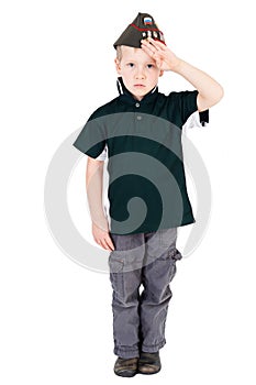 Young caucasian boy saluting full length playing dressups green shirt and replica pilotka