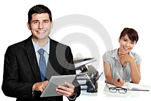 Young caucasian businessman, holding tablet pc. with his team