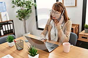 Young caucasian call center agent woman smiling happy working at the office