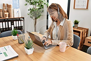 Young caucasian call center agent woman smiling happy working at the office