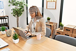 Young caucasian call center agent woman smiling happy working at the office