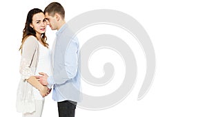 Young caucasian couple: pregnant mother and happy father on white background, baby born photo