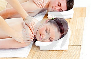 Young caucasian couple receiving a back massage