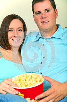 Young Caucasian Couple Watching Movie