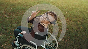 Young caucasian disabled brunette woman looking overshoulder with peace fingers gesture
