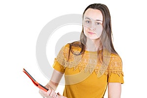 Young caucasian female using tablet isolated on white background