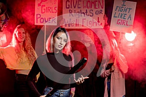 Young caucasian feminist female promoting feminists movement