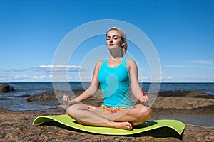 Young caucasian fitness woman practicing yoga