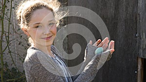 Young Girl Holding Fresh Farm Egg photo