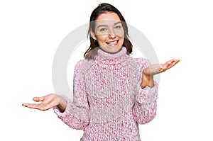 Young caucasian girl wearing wool winter sweater smiling cheerful with open arms as friendly welcome, positive and confident