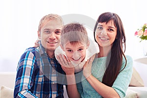 Young Caucasian happy family in their living room have fun while