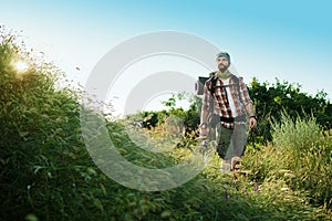 Young caucasian man with backpack walking on a