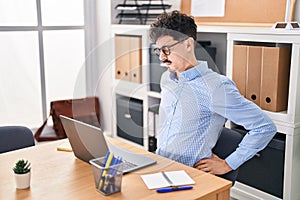Young caucasian man business worker suffering for backache working at office