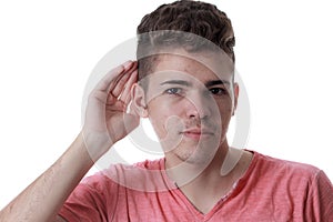 Young caucasian man with his hand to his ear