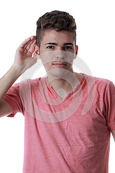 Young caucasian man with his hand to his ear photo