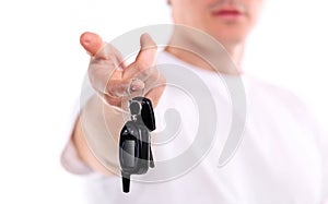 Young caucasian man holding car key