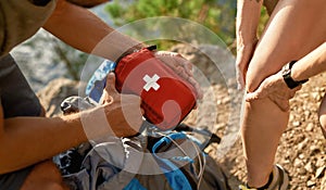 Young caucasian man holding first aid kit for healing