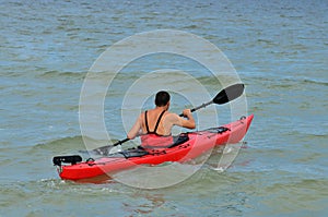 Young caucasian man kayaking