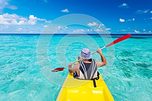 Young caucasian man kayaking