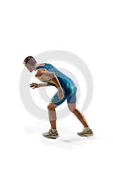 Young caucasian man running or jogging isolated on white studio background.