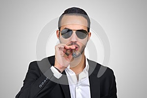 Young Caucasian man smoking cigar