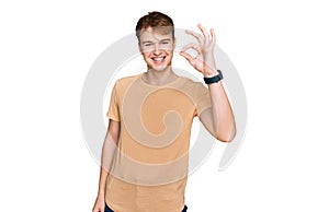 Young caucasian man wearing casual clothes smiling positive doing ok sign with hand and fingers