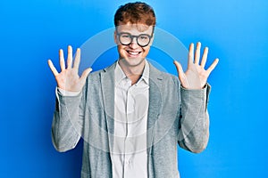 Young caucasian man wearing elegant clothes and glasses showing and pointing up with fingers number ten while smiling confident