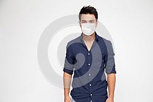 Young caucasian man wearing face mask and looking at camera isolated on white background