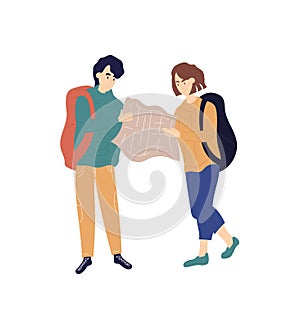 Young caucasian man and woman with backpacks are examining map together