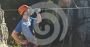 Young Caucasian man in zip lining equipment