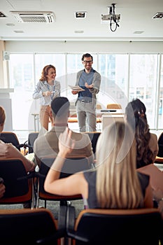 Young caucasian manager lecturing at business seminar