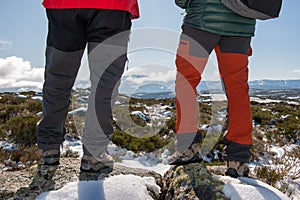 YOUNG CAUCASIAN MEN EQUIPPED WITH MOUNTAIN CLOTHES