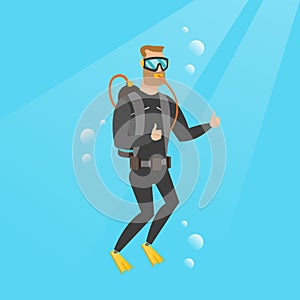 Young caucasian scuba diver giving thumb up.