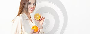 Young Caucasian smiling woman with slices orange over isolated white background.