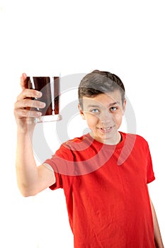 Young caucasian teenage boy drinking cola