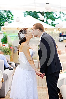 Young caucasian wedding couple kissing