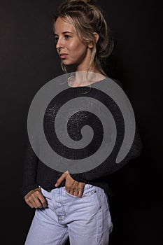 Young caucasian woman with blond bunched hair posing for photoshoot