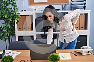 Young caucasian woman business worker suffering for backache at office
