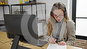 Young caucasian woman call center agent smiling confident working at office