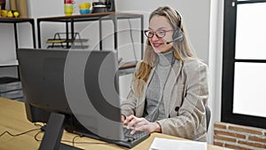 Young caucasian woman call center agent smiling confident working at office