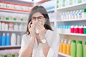 Young caucasian woman customer using nakpin at pharmacy