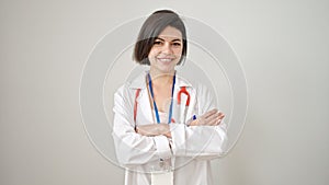 Young caucasian woman doctor smiling confident standing with crossed arms over isolated white background