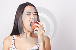 Young caucasian woman eating an apple